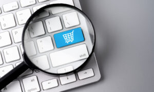 Online shopping &amp; business icon on retro computer keyboard